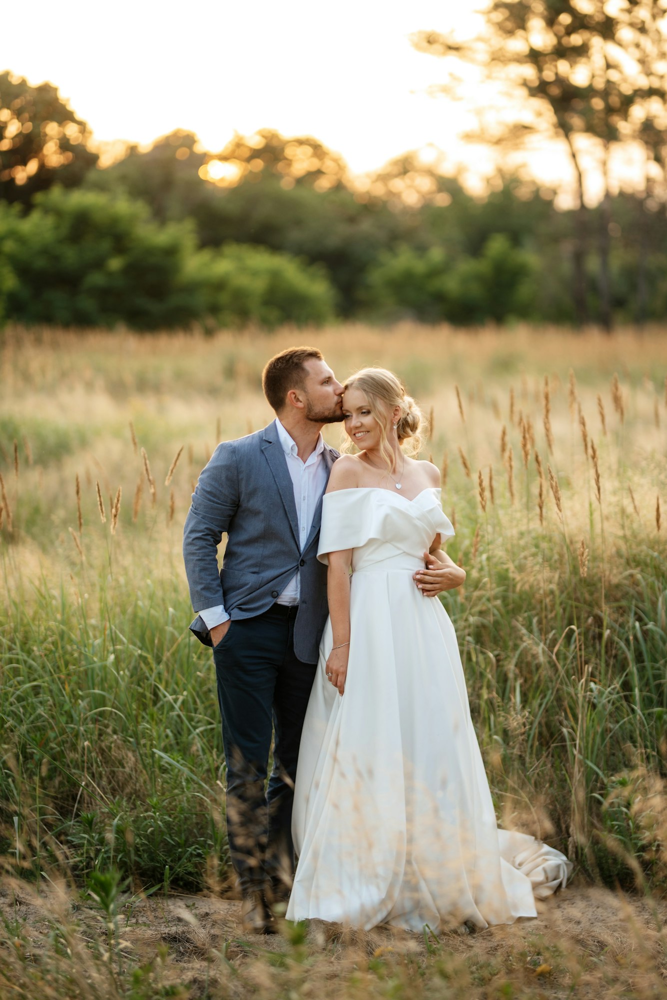 bride and groom on in the woods